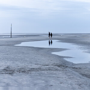 Vier Füße im Sand